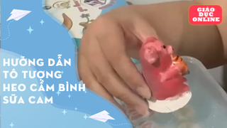 Hướng dẫn tô tượng heo cầm bình sữa cam