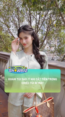 Ý Nhi cất tiền trong chiếc túi bí mật